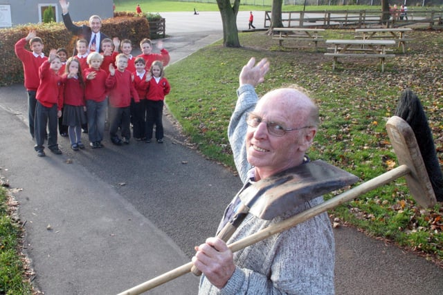Retiring Christ Church School caretaker Donald Marshall being waved goodbye to by head Paul Brooke and a group of pupils