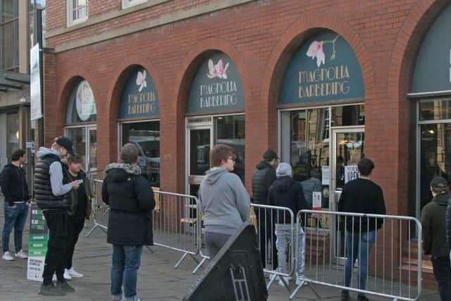 People queuing outside Magnolia Barbering in Chesterfield on Monday as they patiently waited for a post-lockdown haircut.