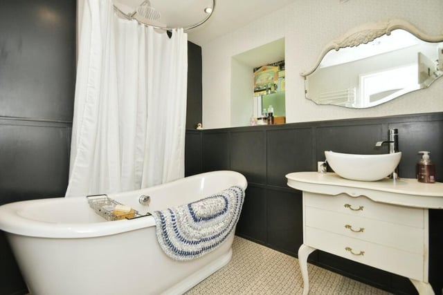 Stunning views of the countryside are also offered in the bathroom which is fitted with a modern slipper-style bath.