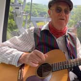 John Gill singing his song in a cable car on the journey to The Heights Of Abraham.