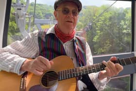 John Gill singing his song in a cable car on the journey to The Heights Of Abraham.