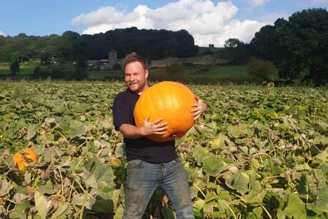 Chris Tomlinson with a whopping pumpkin at Ashover Sunflowers and Pumpkins.