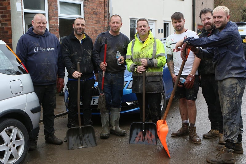 Volunteers who turned up to help residents clear houses off Chatsworth Road. Residents complained to DT's photographer that more should have been done by authorities.
