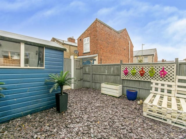 With a decked seating area to the rear elevation and the rest is slate.