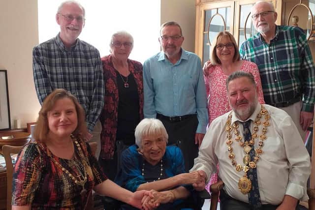 Honor Graham is greeted by the Mayor of Chesterfield, Councillor Mick Brady and Mayoress, Councillor Suzie Perkins, front row, left, on her visit to the Mayor's Parlour. Pictured on the back row, left to right, are Jim Howard (son in law who lives in Chesterfield) Dinah Selby (Honor's eldest daughter, visiting from New Zealand),  Charles Graham (Honor's son visiting from New Zealand),  Colleen Howard (youngest daughter who lives in Chesterfield) and  Richard Selby (son in law, visiting from New Zealand).