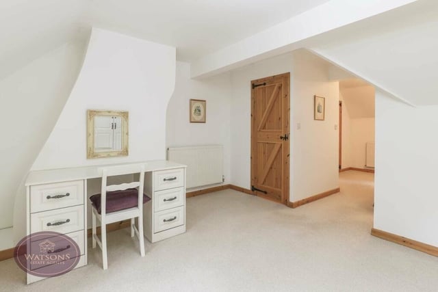 The main bedroom is so large that it includes a dressing room, with dressing table, plus access to an en suite shower room..