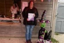 Rebecca Robinson with her scarecrow which was voted runner-up in the adults' section.