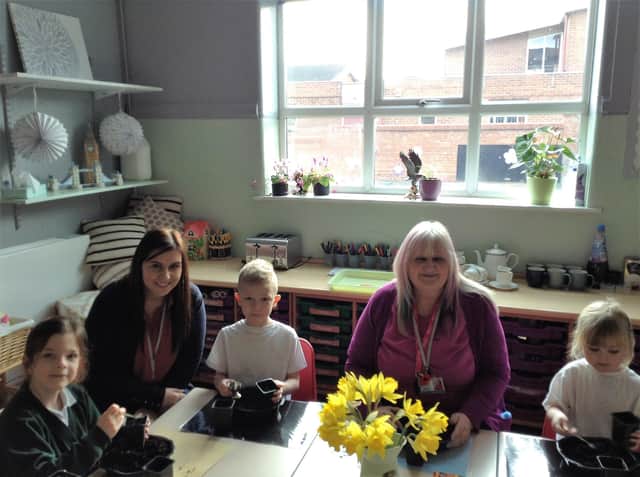 Children at Whittington Moor Nursery and Infant Academy pictured with headteacher Lauren Kay in The Saplings