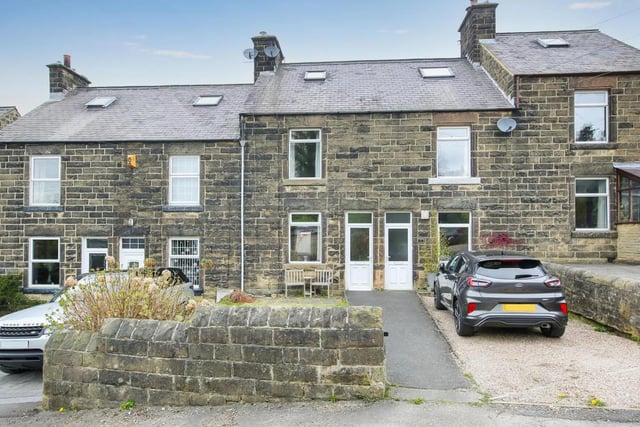 A three bedroom terraced house with front and rear gardens; it has a market value of £225,000.