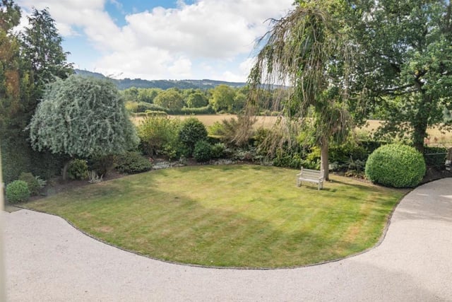 Thornhill House is set on a plot measuring a third of an acre. There is a wide gravelled drive at the front of the property and a block paved driveway leading to the rear of the house.
