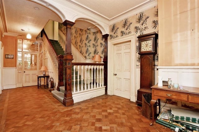 Picture yourself making a grand entrance down this lovely sweeping staircase and stepping out onto the original parquet flooring.