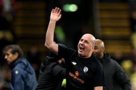 Paul Cook on the touchline at Vicarage Road. (Photo by Richard Heathcote/Getty Images)