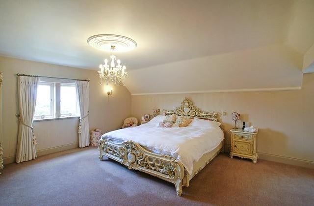 An exceptionally spacious principal  bedroom enjoys views over Holymoorside and open countryside. This room could easily be divided to create a fifth bedroom, or separate dressing room.