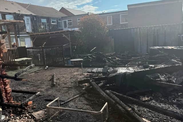 The aftermath of the fire which destroyed the rear garden at Lydia's  cafe on Market Street, Clay Cross.