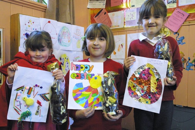 Sophie Bowler, 3, of Cromford Playgroup and Jade Smith, 11, and Catherine Wragg, 6, of Cromford C of E Primary School with their winning designs for the Easter egg competition.