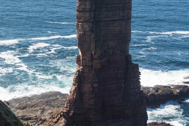 Sam Wragg and his friend Steve seen from a distance as they topped the Old Man of Hoy