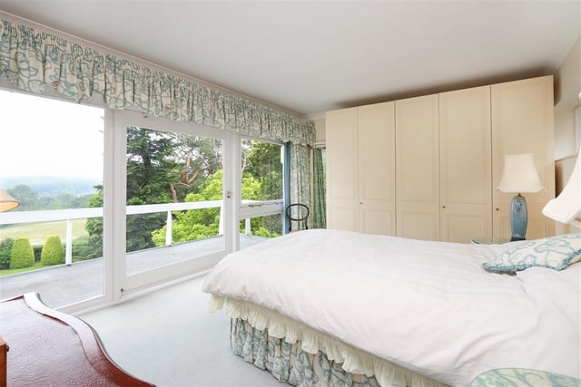 The double master bedroom has its own balcony and a stunning view of the countryside.