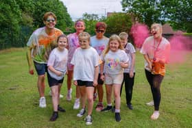 Sharley Park community primary school colour run as part of pride celebration. children with teachers Mr Thompson and Miss Peat.