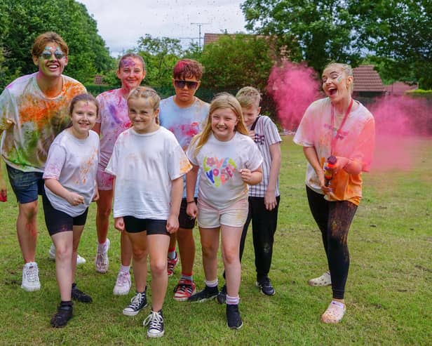 Sharley Park community primary school colour run as part of pride celebration. children with teachers Mr Thompson and Miss Peat.