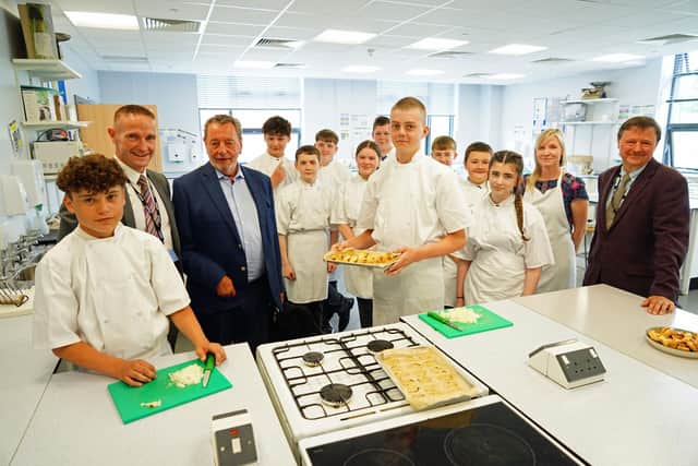 The Right Honourable Lord Blunkett at David Nieper Academy in Alfreton, seen with Christopher Nieper OBE and headteacher Richard White and year 9 pupils GCSE hospitality and catering lesson.