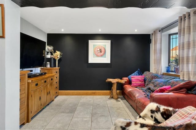 Put your feet up in front of the telly in this cosy and relaxing part of the open-plan family living area in the £250,000 cottage.