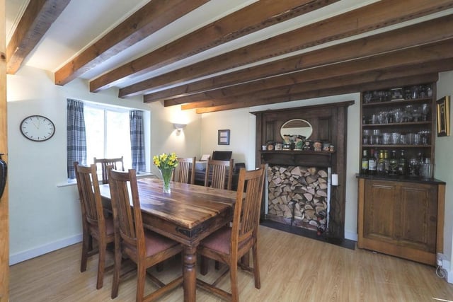 The delightful dining room has more than enough space for a table and chairs. It features laminate flooring, wall lights, a glazed window to the front of the property and double doors opening into the lounge.