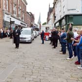 Don Hollingworth's funeral cortege passes the market. Inset, the late Don Hollingworth.