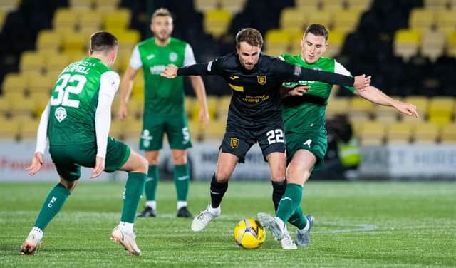 Paul Hanlon and Josh Campbell look to dispossess ex-Hibs midfielder Andrew Shinnie during their 1-0 defeat at Almondvale. Picture: SNS