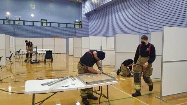 Firefighters prepare Derbyshire's newest community Covid testing centre at William Gregg VC Leisure Centre in Heanor.