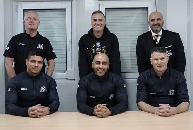 Steve Chettle (back, centre) and Mark Clifford (front, centre) have new roles at Basford United.