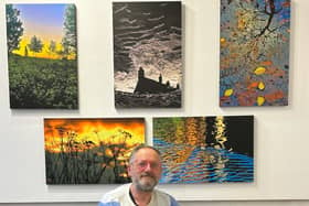 Tony Fisher with his nature photos.
