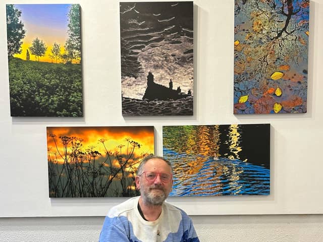 Tony Fisher with his nature photos.