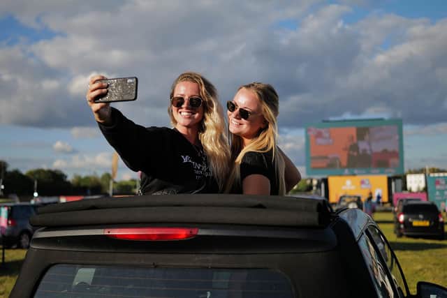 Guests take a selfie at a drive-in cinema. Picture: Gareth Cattermole/Getty Images.