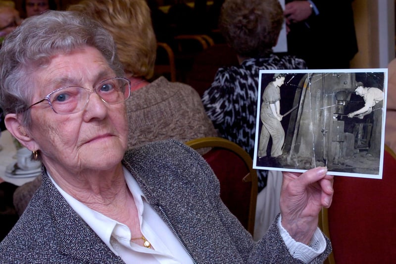 Women of Steel attend a special event at the Bailey Suite in Rotherham  in 2010 where Veterans minister Kevan Jones attended to thank them for their work in the steel works during the war. Eva Ward with a picture of herself in the steelworks