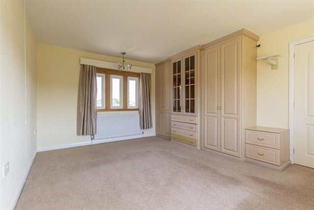 The farmhouse has three double bedrooms, two of which have fitted wardrobes.