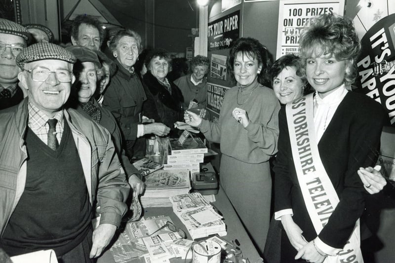 Visitors to the Sheffield holiday and travel exhibition playing The Star Wheel of Fortune with Miss Yorkshire Television Zoe Bolsover in 1988