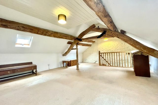 Located on the second floor, this generous bedroom has beamed vaulted ceiling and a-frame, four roof lights that draw in plenty of natural light and an additional smaller window to the gable.