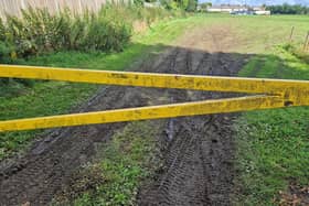 A popular event has been cancelled after vehicles belonging to a group of travellers left a park unsafe and covered in mud.