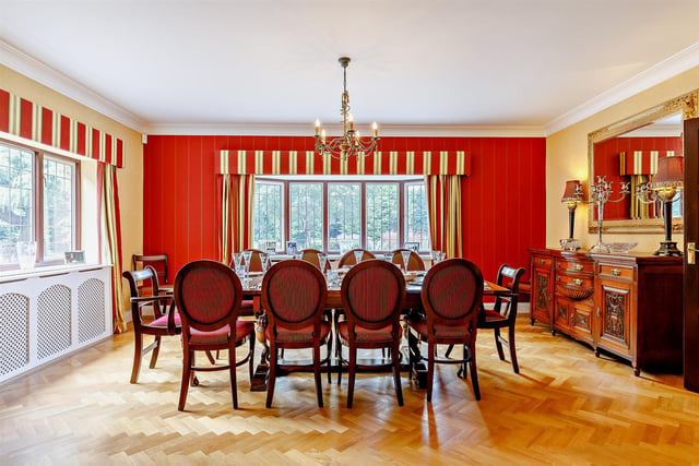 There is a large formal dining room with oak parquet floor and dual aspect windows with a bay window to the front.