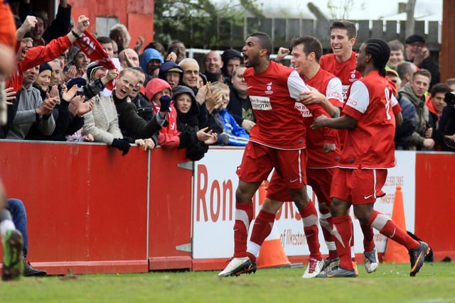 Daryll Thomas is mobbed by team-mates.