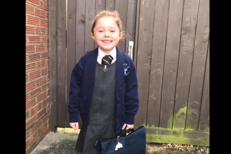 Emily, aged five, was all smiles as she returned to school today