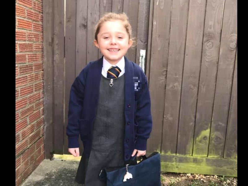 Emily, aged five, was all smiles as she returned to school today