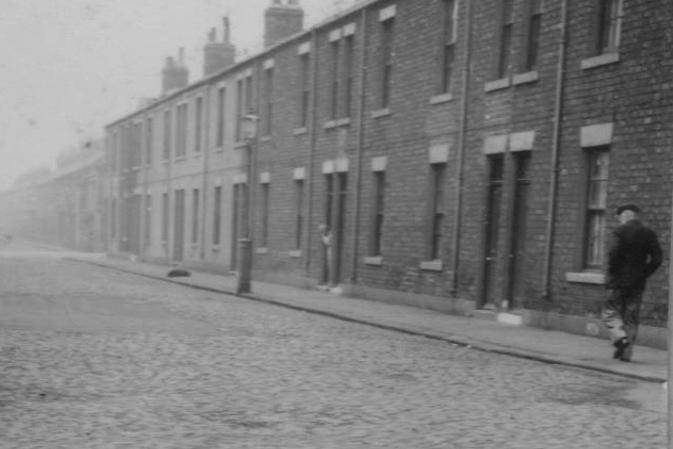 A lone walker on Mill Street which ran west from Baltic Street. Photo: Hartlepool Library Service.