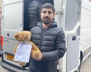 Rico Gunes with the teddy donated by five-year-old Ayda which is among the vanload of supplies bound for Turkey.