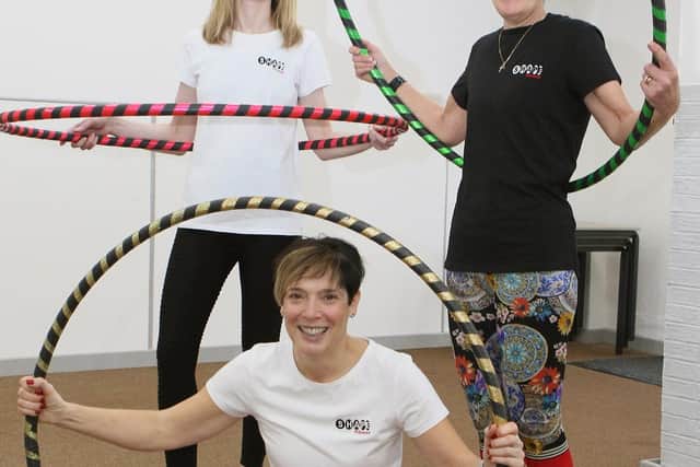 Helen Garner, Nicky Blakey and Jane Brown from Shape Fitness demonstrating their Hula Hooping skills.