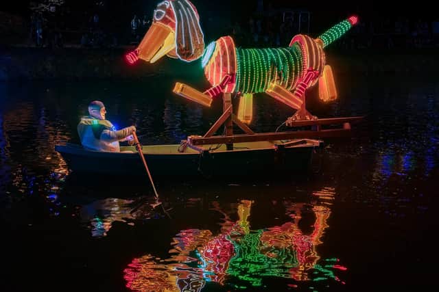 Boat builders Richard Wood, Christine Dence and Pete Hartshorn have won the boat vote at this year’s Matlock Bath Illuminations with their stunning Slinky Dog model. Credit: Simon Beynon/Derbyshire Dales District Council