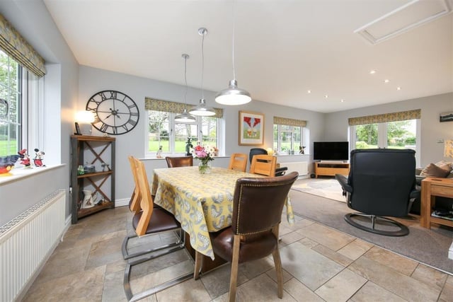An open plan layout sees the kitchen flow into the breakfast area which leads onto the garden room.