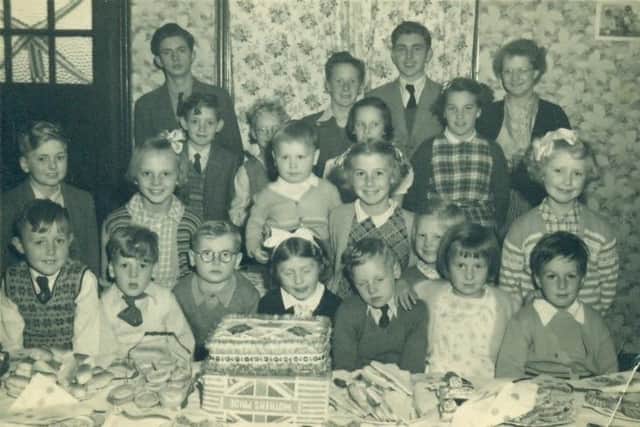 The party at Old Whittington to mark Queen Elizabeth's coronation. John Cuttriss is second from the right on the back row.