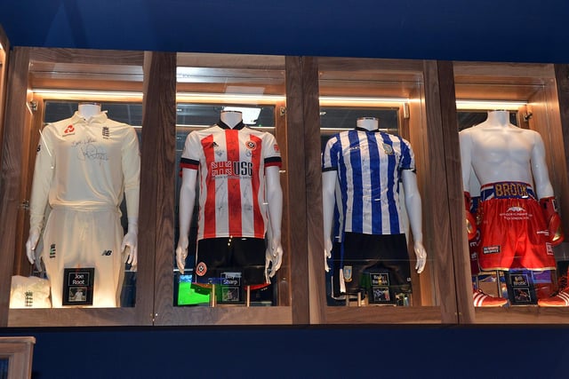 This cabinet contains a signed Sheffield United kit from Billy Sharp, an autographed Sheffield Wednesday strip from Barry Bannan, Joe Root’s Test Match cricket outfit, and Kell Brook’s boxing gloves, shorts and boots.
