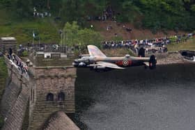 A Lancaster bomber over Derwent dam in the Peak District, to mark the 65th anniversary of the Dambusters raid. A new museum at Derwent to mark the raids has been delayed and could be years away (pic: David Jones/PA Wire)